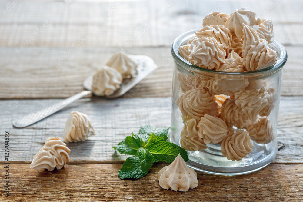 Delicate meringue and mint in a glass jar.