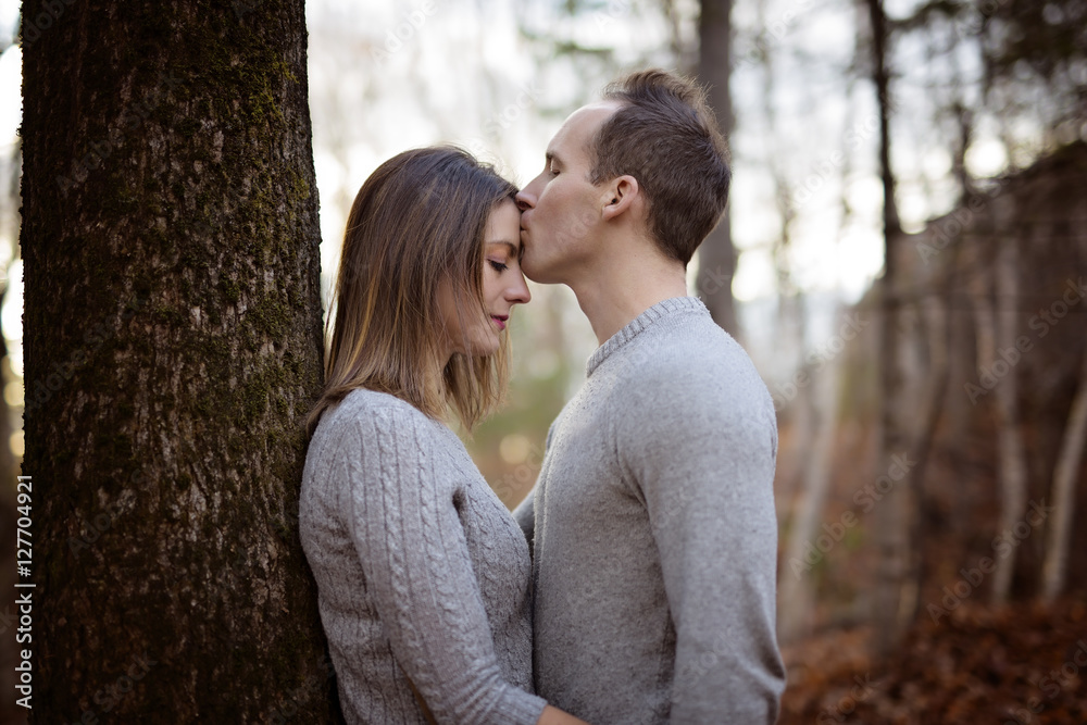 Fototapeta premium young fashion beautiful loving casual style couple on floral field in autumnal park