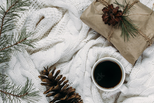 New Year's background. coffee and Christmas toys and warm scarves.