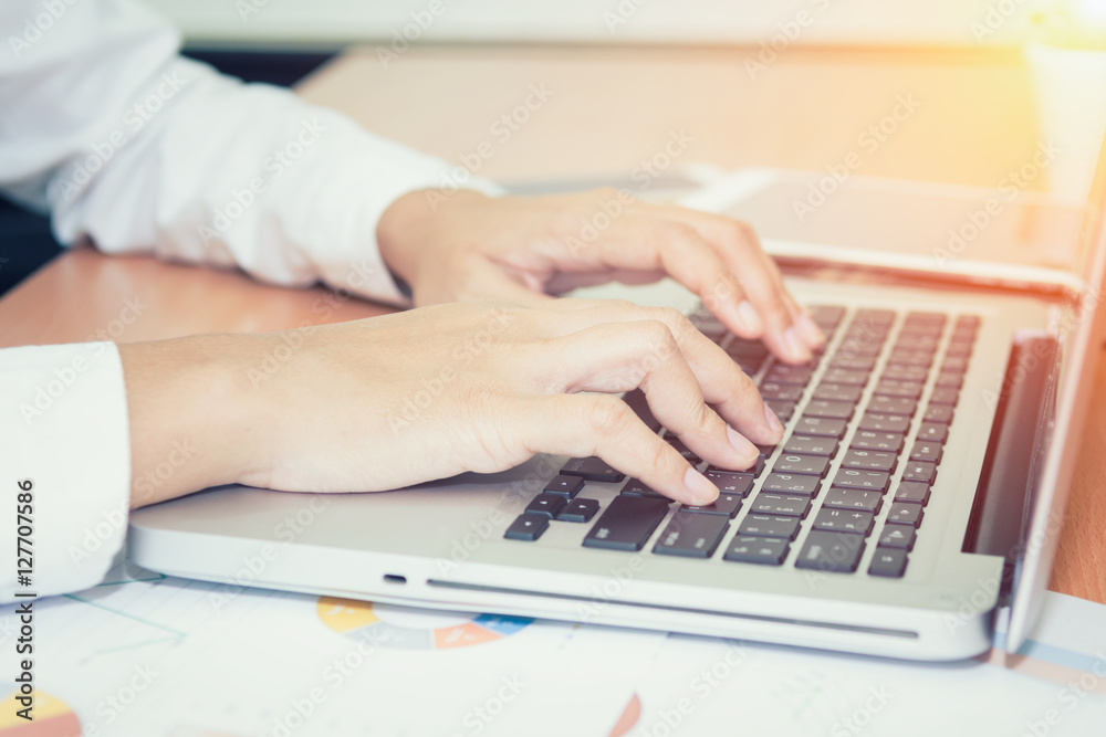 Closeup of business woman hand typing on laptop keyboard Closeup of business woman hand typing on laptop keyboard