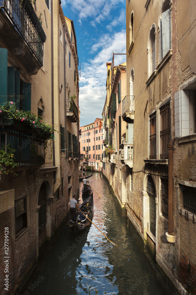 Canals and exterior of old building of Venice