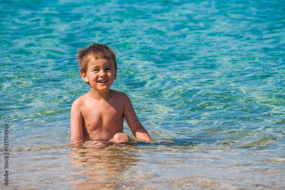 Little boy enjoying his summer sea vacation. Little boy enjoying his summer sea vacation.