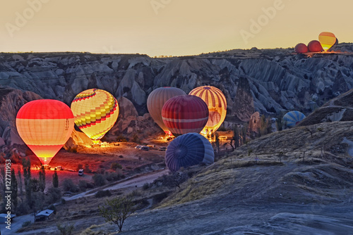 Colorful hot air balloons before launch at Cappadocia, Turkey. Volcanic mountains in Goreme national park
