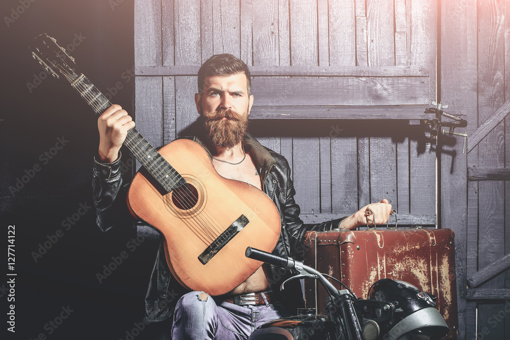 Obraz premium Bearded man hipster biker