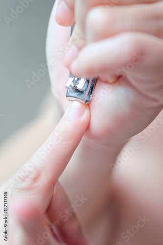 Cutting nails using nail clipper 