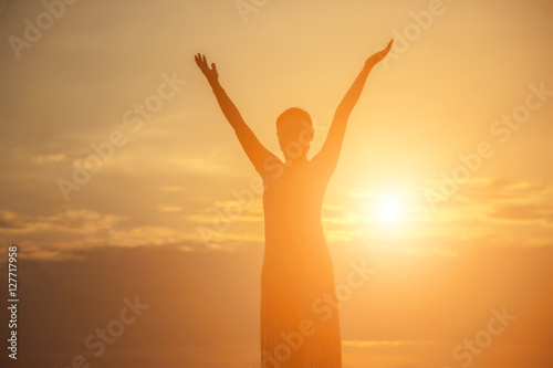 Young woman raise hands up for her success, Concept of Success i