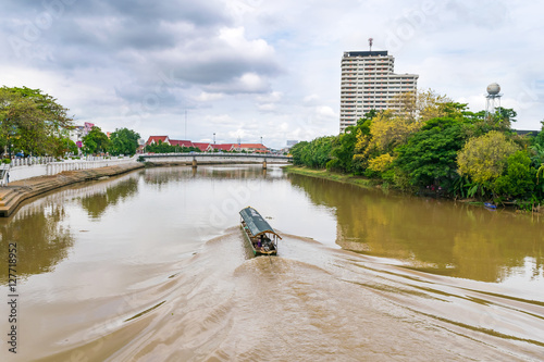 Tourist boat in main river (Ping river) in Chiangmai Thailand for seeing beautiful view of city both side of the river.
