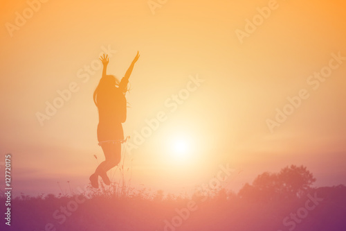 Young woman raise hands up for her success, Concept of Success i