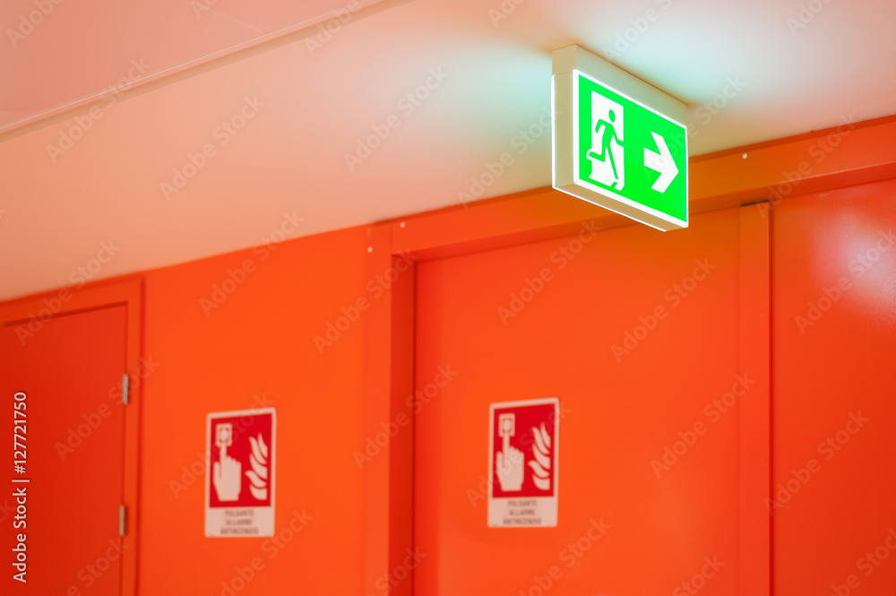 Bright green safety exit signal. Bright green safety exit signal.