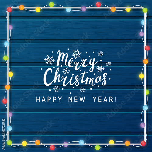 Christmas light bulbs on wooden background