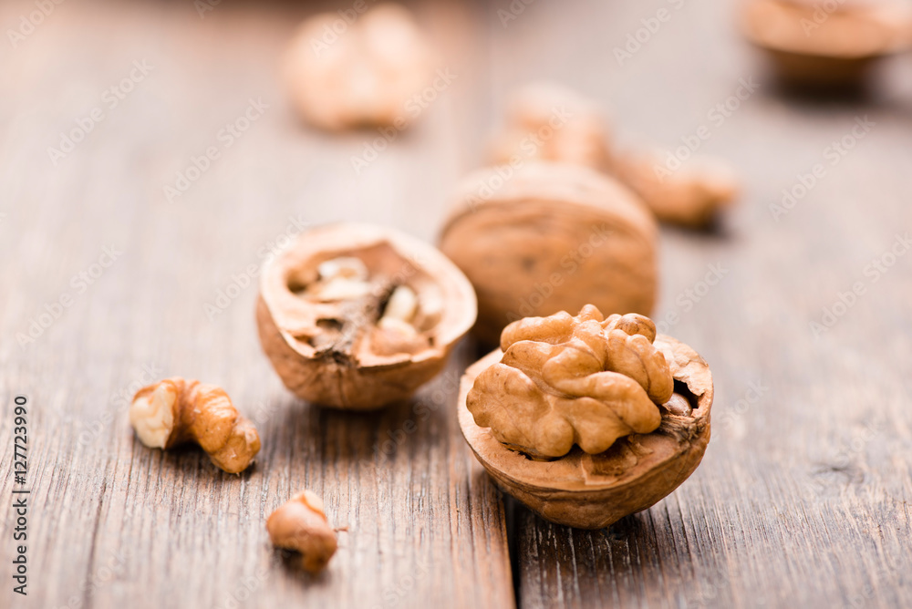 Walnuts on wooden table. Macro. Front view Walnuts on wooden table. Macro. Front view