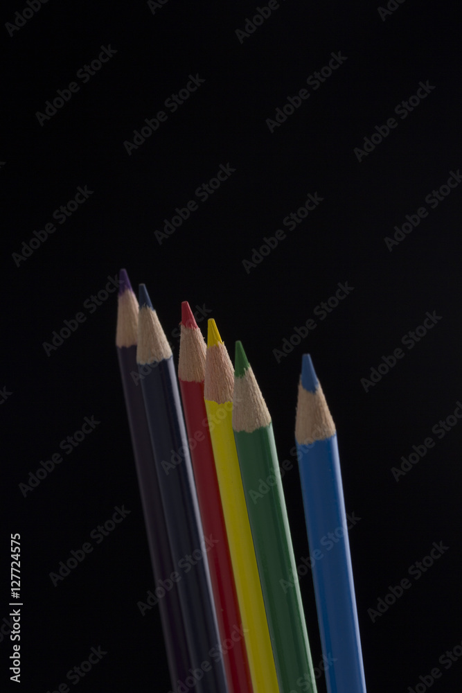 set of colour pencils isolated on black background set of colour pencils isolated on black background