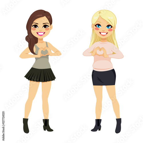 Full body beautiful brunette Latina and blonde Caucasian girl making heart symbol with hands