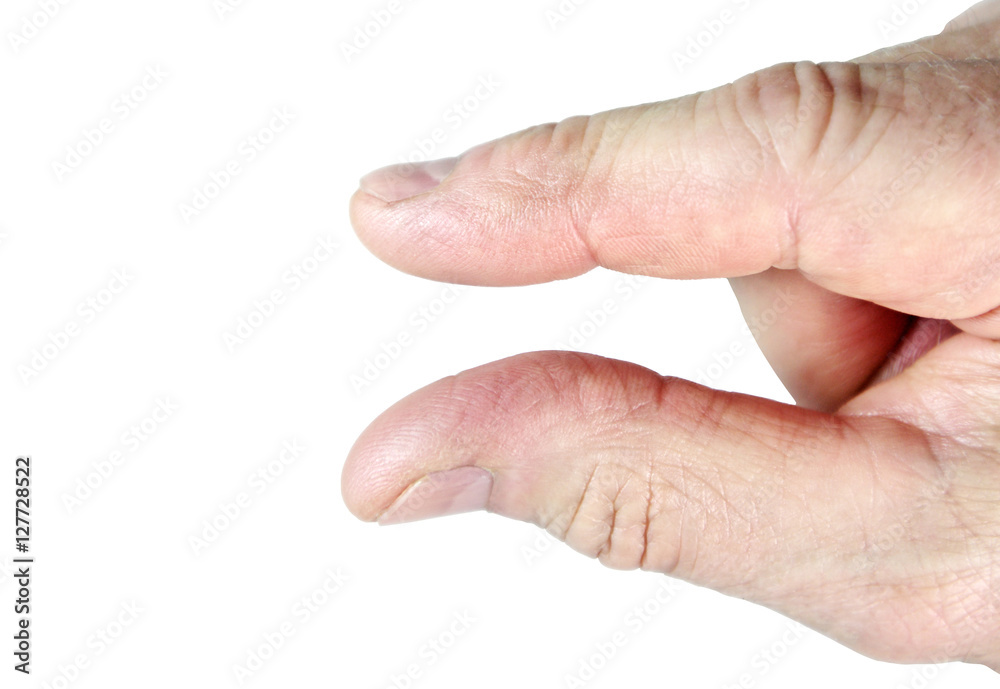 Caucasian thumb and index finger indicating just a little bit Caucasian thumb and index finger indicating just a little bit