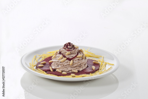 piatto pere al vino rosso con mousse di cioccolato salsa di riduzione e limone  photo