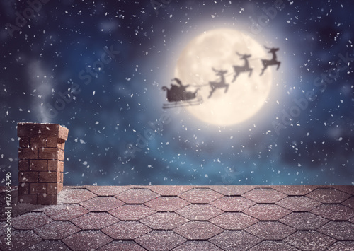 Santa Claus flying in his sleigh