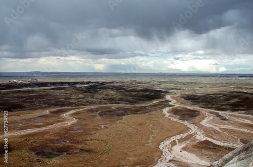 Look over a desert under rain showers