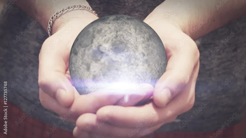 the moon revolves in hands young man the moon revolves in hands young man