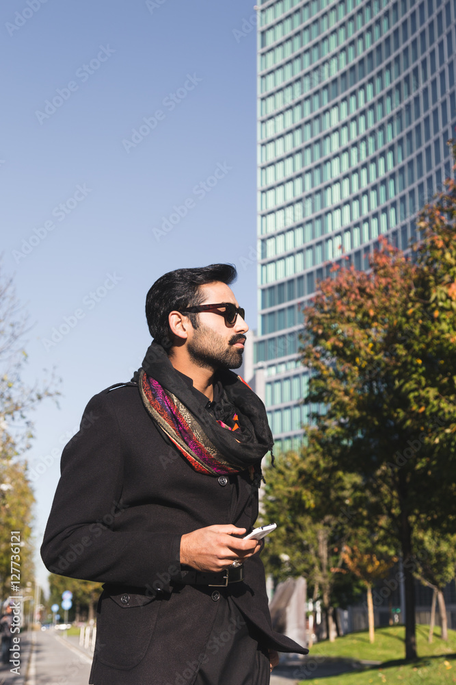 Fototapeta premium Indian man posing in an urban context.