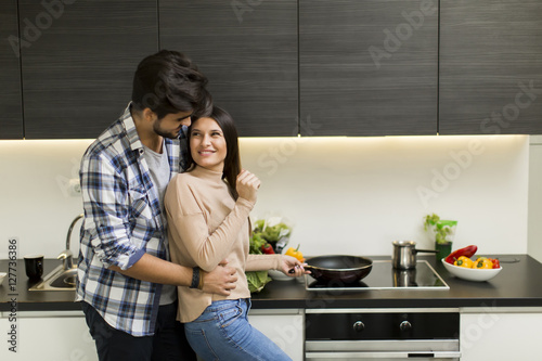 Young couple preparing meal
