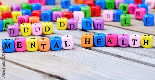 Mental Health words on wooden table