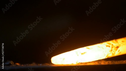 Blow to the hot metal