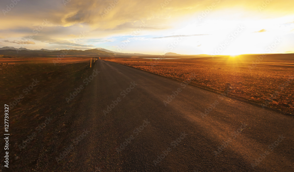 Straight road across the desert in Iceland, Sunset HDR