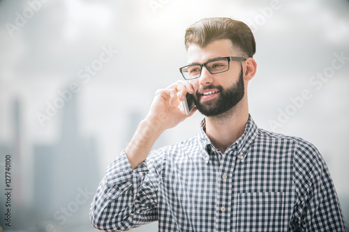 Happy boy on phone