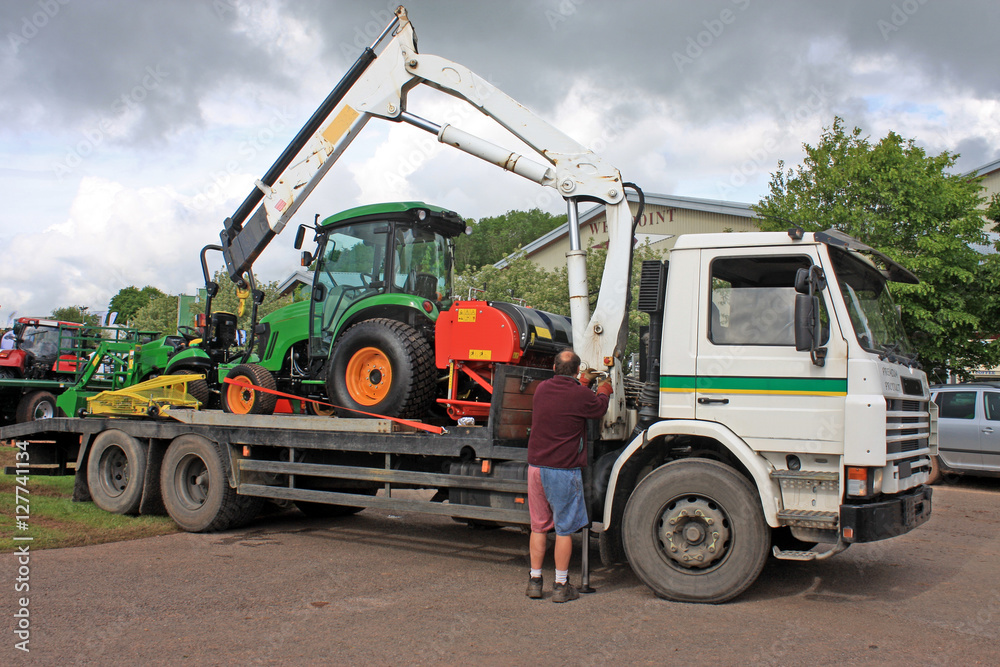 Tractor loaded on a truck
