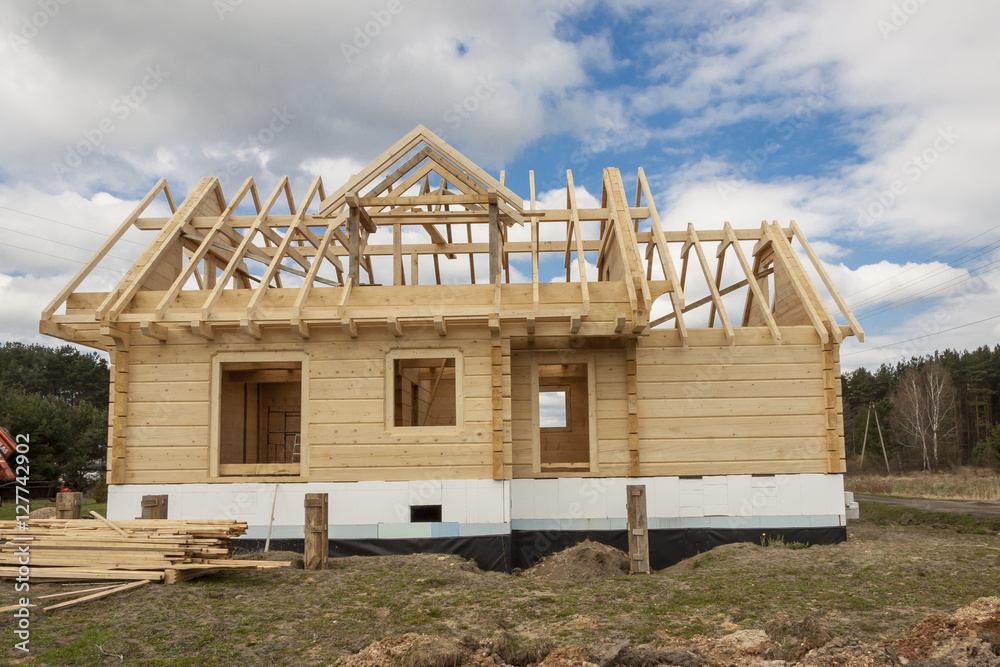 Wooden house under construction. Wooden house under construction.