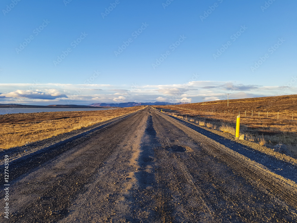 Traveling down the gravel road in desert, Kjolur Highland route F35 Volcanic Iceland Traveling down the gravel road in desert, Kjolur Highland route F35 Volcanic Iceland