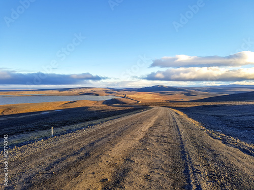 Traveling down the gravel road in desert, Kjolur Highland route F35 Volcanic Iceland