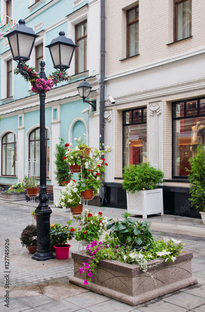 flowerbed and lamp in city center
