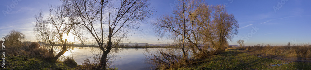 Beautiful panorama by the river in winter Beautiful panorama by the river in winter