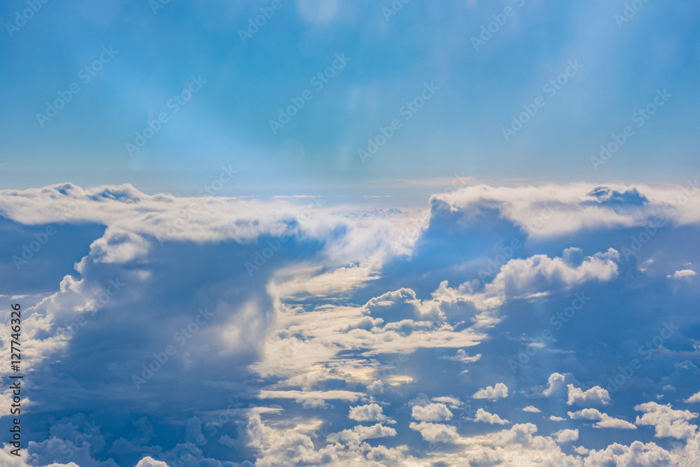Fototapeta premium Above Clouds Airplane Window Blue Daytime Fluffy Column Wispy Wh