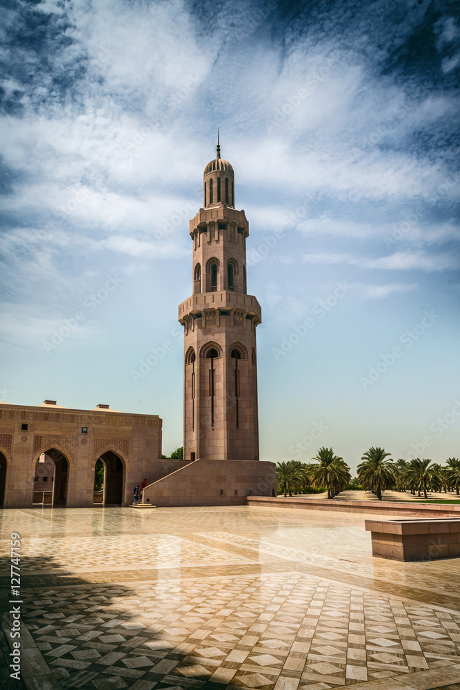 Solitary tall stone minaret with domed top