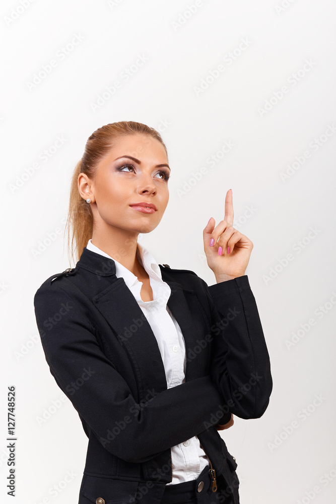Business woman show finger. Long hair model isolated on grey background. Holding finger up Business woman show finger. Long hair model isolated on grey background. Holding finger up