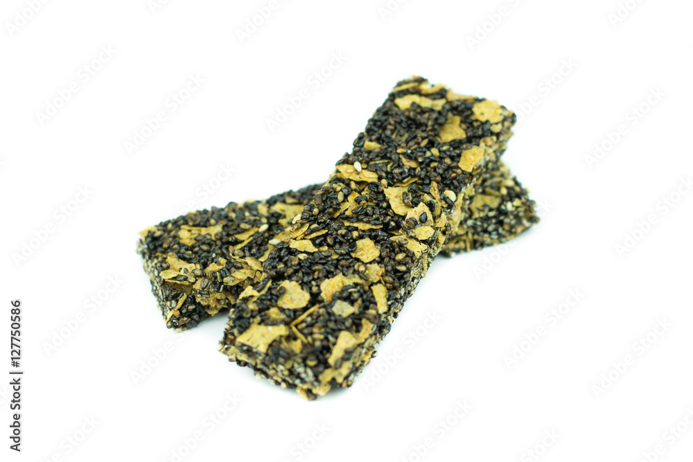 Fototapeta premium Healthy cereal bar with black sesame isolated on white backgroun