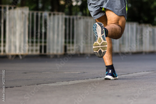 Adult men running marathon in the city