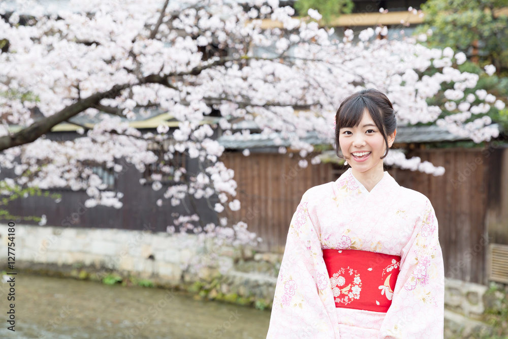 attractive asian woman wearing kimono looking cherry blossoms attractive asian woman wearing kimono looking cherry blossoms