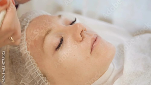 Applying gel for ultrasound in cosmetic cabinet photo