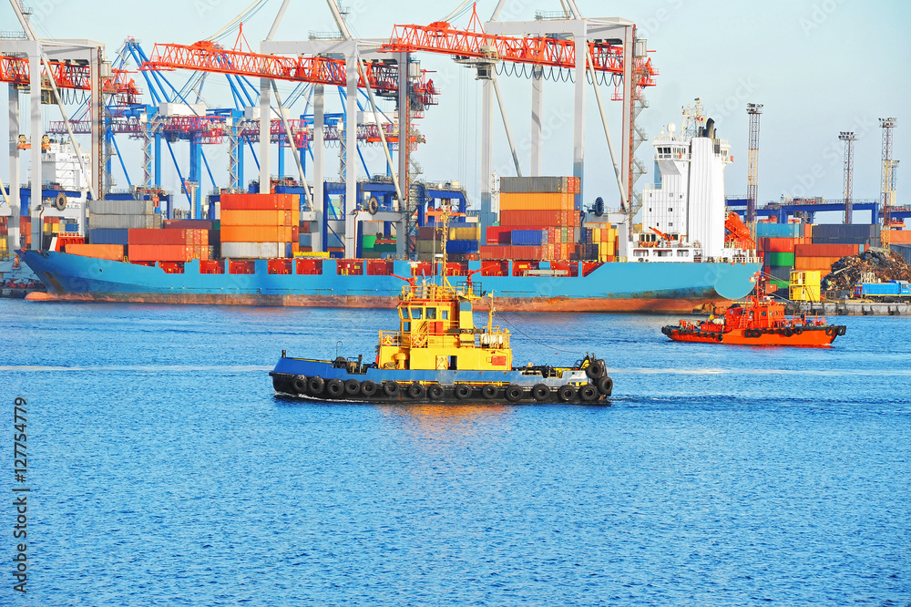 Fototapeta premium Tugboat and port cargo crane