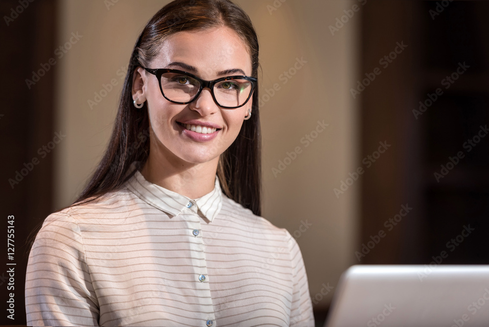 Young woman posing in an office Young woman posing in an office