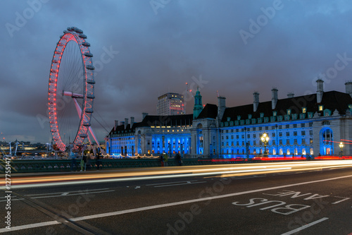 Canvas Print LONDON, ENGLAND - JUNE 16 2016: Night photo of The London Eye and County Hall fr