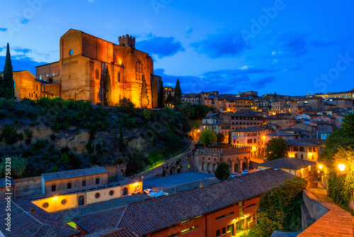 Fototapeta Naklejka Na Ścianę i Meble -  Night view of Siena and Basilica of San Domenico (Basilica Cateriniana) is basilica church in Siena, Tuscany, Italy, one of the most important of Siena.