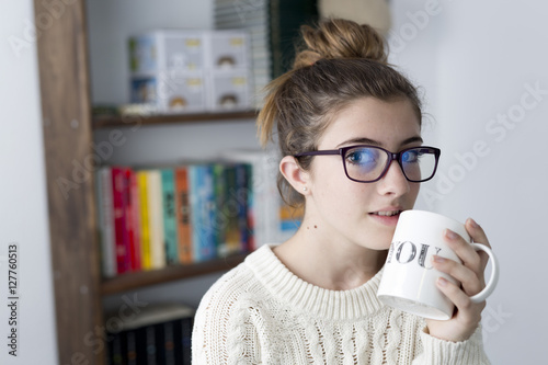 Portrait of teen with glasses.