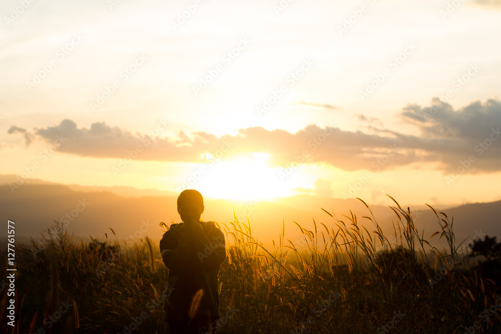 standing on a mountain, enjoying the sunset standing on a mountain, enjoying the sunset