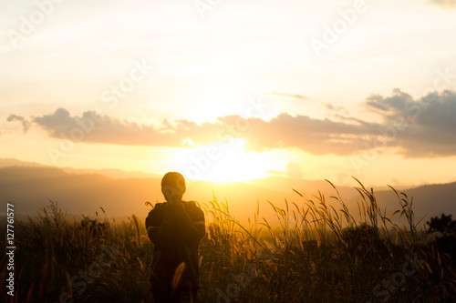 standing on a mountain, enjoying the sunset © ณัฐวุฒิ เงินสันเทียะ