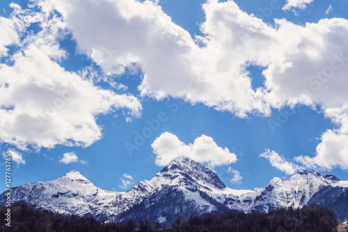 Beautiful snowy Aibga mountain peak blue cloudy sky winter scenery