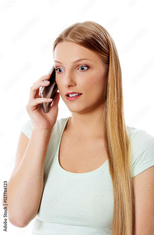 Attractive young woman making a phone call. Attractive young woman making a phone call.